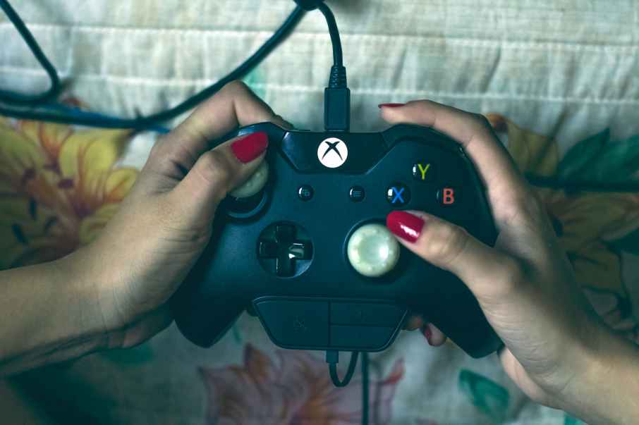 person holding microsoft xbox one controller